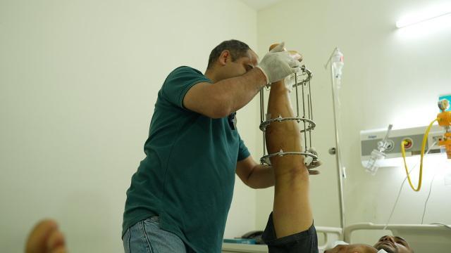 Patient showing height improvement after successful surgery